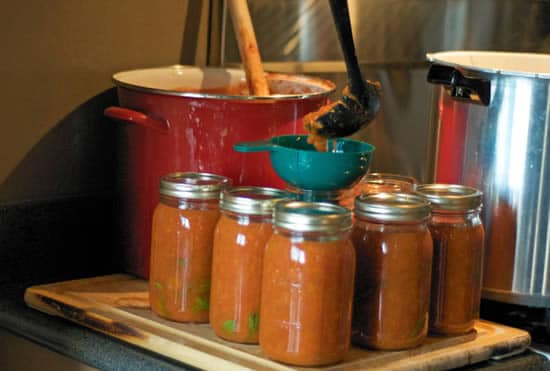 Ladling Tomatoes into Jars