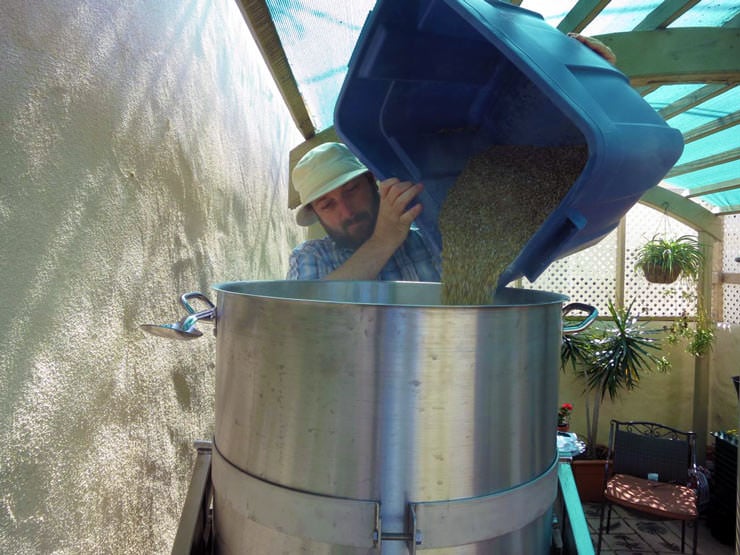 pouring grains into the mash tun