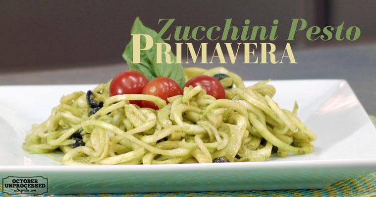 zucchini noodles with pesto sauce and cherry tomatoes