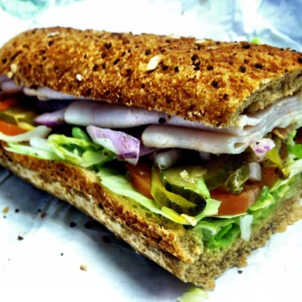A typical Subway sub: multigrain bread loaded with lettuce, tomatoes and red onions, but also deli turkey, pickles and peppers.